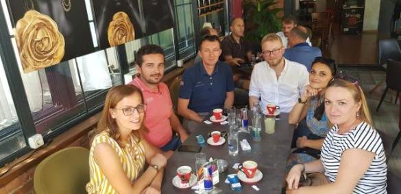 Working Worldwide Kosovo participant (third from left) out for coffee with his colleagues